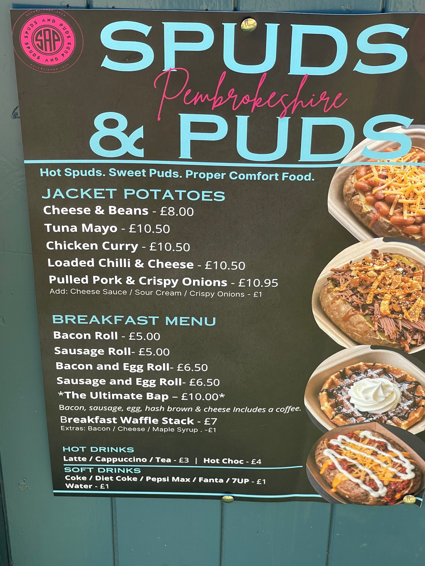 Spuds & Puds Pembrokeshire menu poster with jacket potatoes, breakfast items, hot drinks and soft drinks